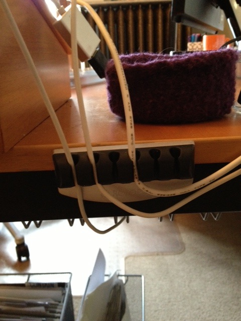 Rolodex cord organizer keeps cords in place when unplugged from the laptop.