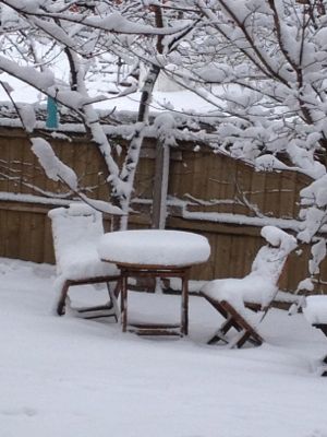 Lots of snow on picnic table