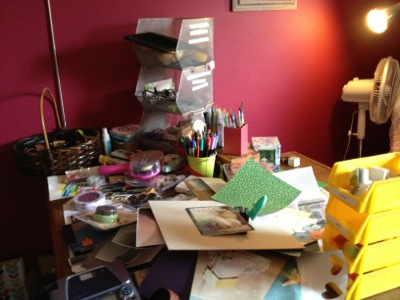 A cluttered craft desk before team help